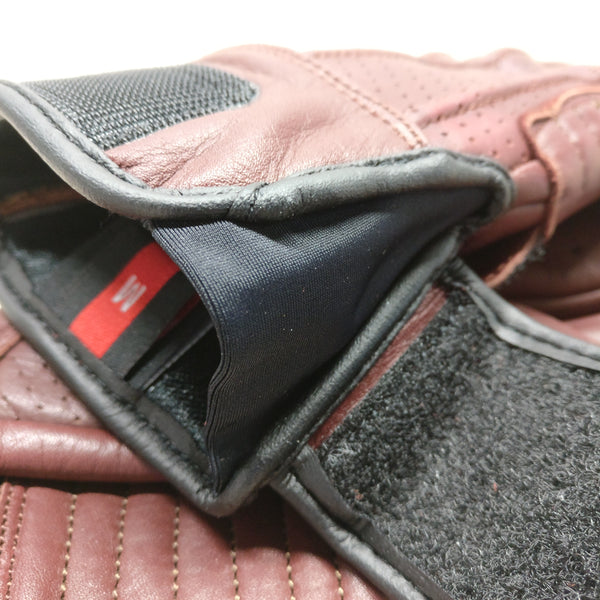 A close up of a motorcycle gloves with a lycra draft gusset